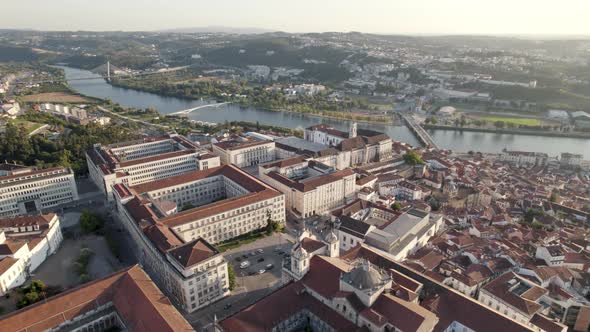 Aerial orbiting around Coimbra University and Mondego river in background, Portugal