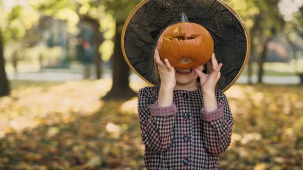 Spooky face with small pumpkins