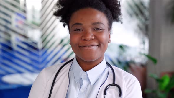 African American Female Doctor Health Worker with Arms Crossed Portrait on Grey