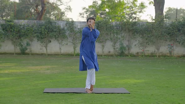 Indian man doing basic yoga pose