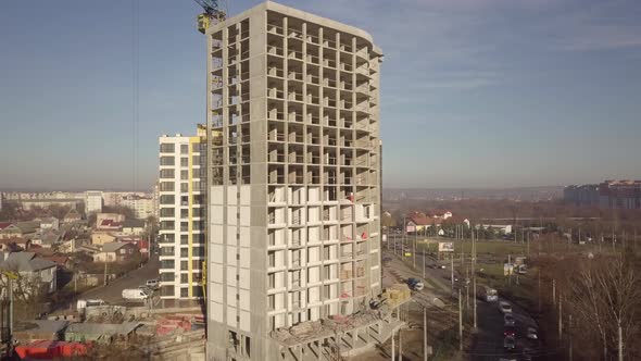 Aerial View of Concrete Frame of Tall Apartment Building Under Construction in a City