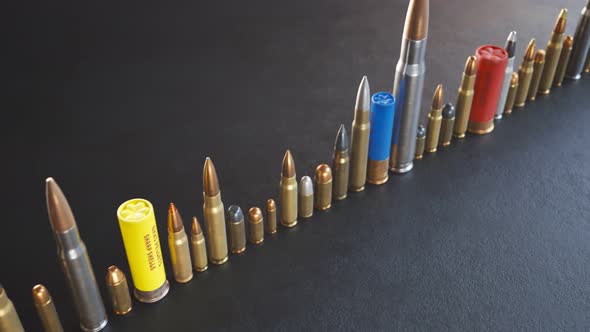 An endless row of different ammunition types standing on the ground in a loop.