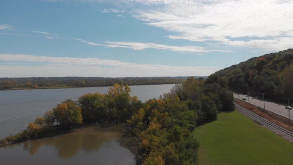 Aerial view of the Illinois River from a riverfront highway in Peoria, Illinois during the fall