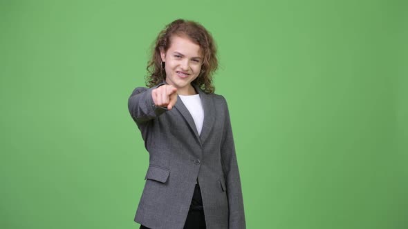 Young Happy Beautiful Businesswoman Pointing To Camera