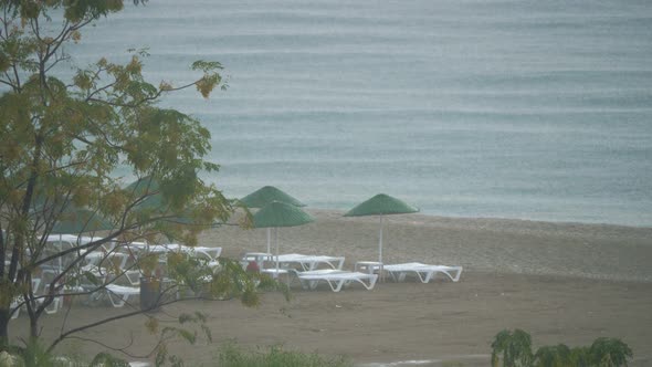 Hard Rain at the Empty Resort Beach.