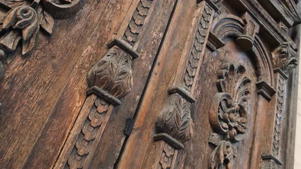 Slide Shot of an Old Wooden Door of a Beautiful Ancient Building. Wood Texture Doors. Close Up