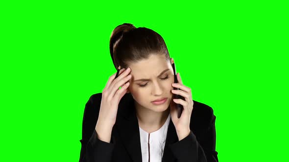 Businesswoman Under Stress Speaking at the Phone. Green Screen