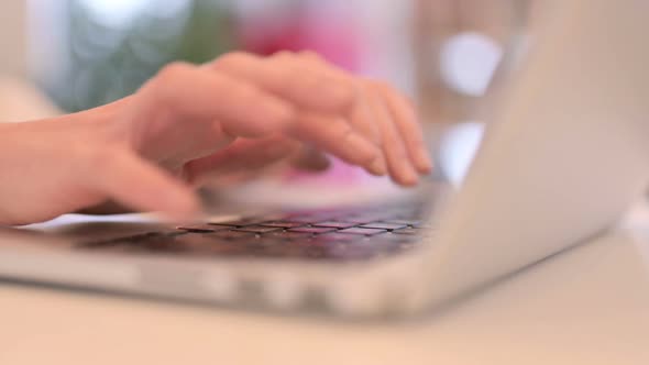 Close Up Woman Typing on Laptop Keyboard