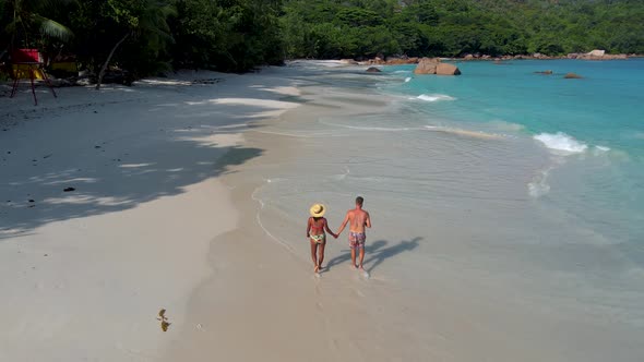 Praslin Seychelles Tropical Island with Withe Beaches and Palm Trees Couple Men and Women Mid Age on