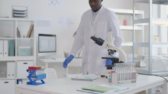 African Scientist Starting Using Microscope