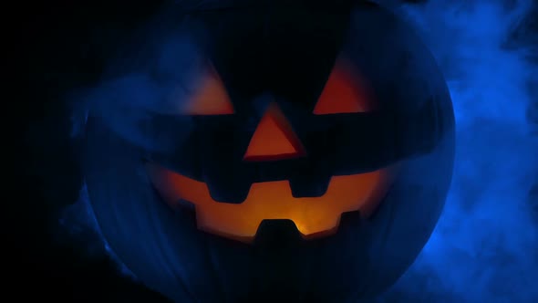 Blue Smoke Billows From Face Of Halloween Pumpkin