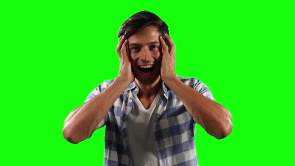 Front view of Caucasian man surprising with green screen