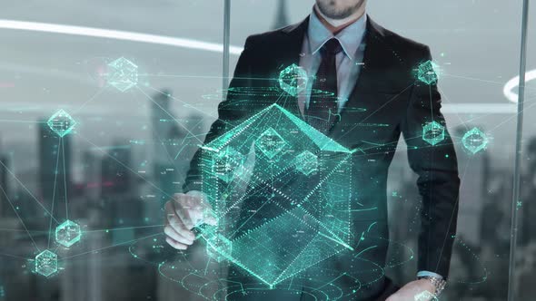 Businessman with Green Blockchain Hologram Concept