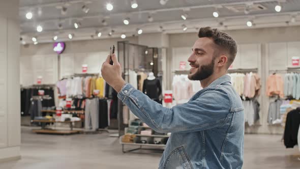 Man Video Chatting At Clothing Store