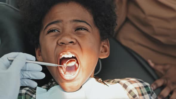 Black Boy Opening Mouth for Dental Care