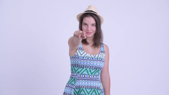 Happy Young Beautiful Tourist Woman Pointing at Camera
