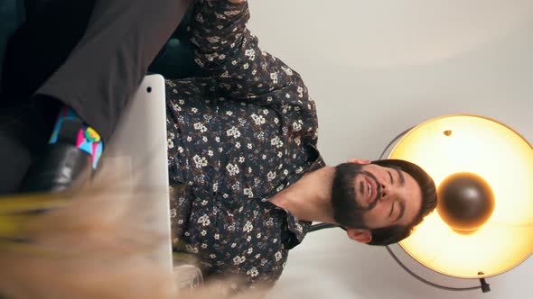 Vertical Shot of a Modern Office and Confident Sexy Businessman Guy in Floral Shirt Catching His