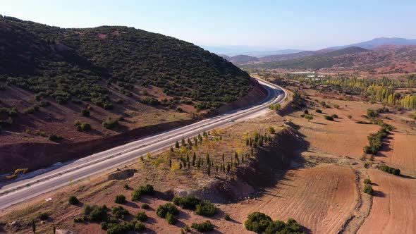 Aerial View of Country Road and Picturesque Summer View of Mountains