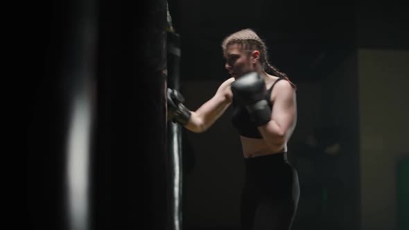 Woman Power Female Fighter Trains His Punches Beats a Punching Bag Training Day in the Boxing Gym