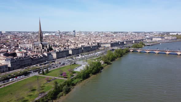 Basilica Of St. Michael And Pont de Pierre By The Garonne River In Bordeaux, France On A Sunny Day.