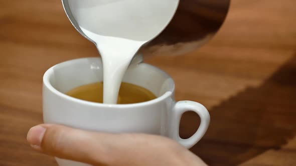 Close-up View of a Barista Demonstrating the Art of Pouring and Preparing a Cup of Coffee. Making