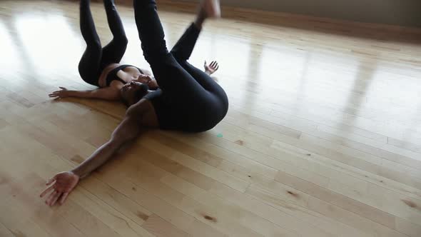 Partner Yoga performance done by two professional instructors