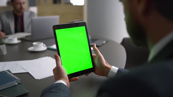 Financial Worker Browsing Tablet Green Screen Searching Web in Business Centre