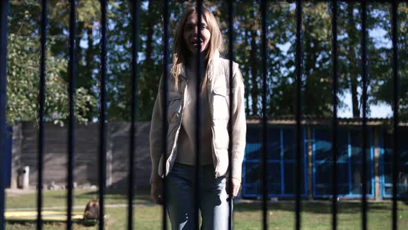 Dog POV Cheerful Young Beautiful Woman Approaching to Cage Talking Smiling in Slow Motion