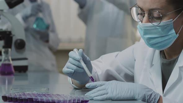 Female Scientist Doing Experiment in Lab