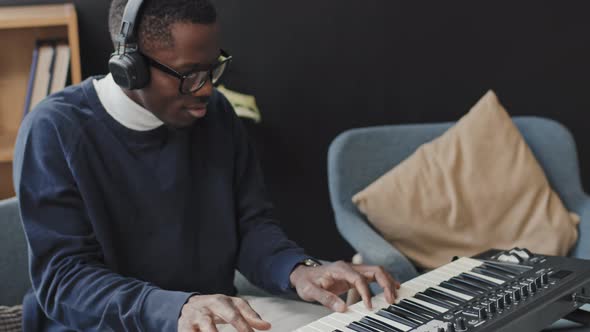 Man Playing Synthesizer