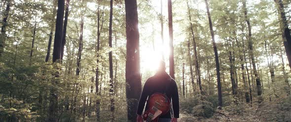 Guitar Player in the Woods