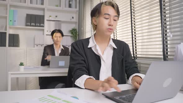 Asian handsome businessman gay people working in office with happiness.