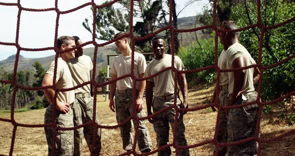 Military soliders interacting with each other at boot camp