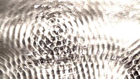 Interference patterns in a wave tank oscillate between states of quiescence and complexity.