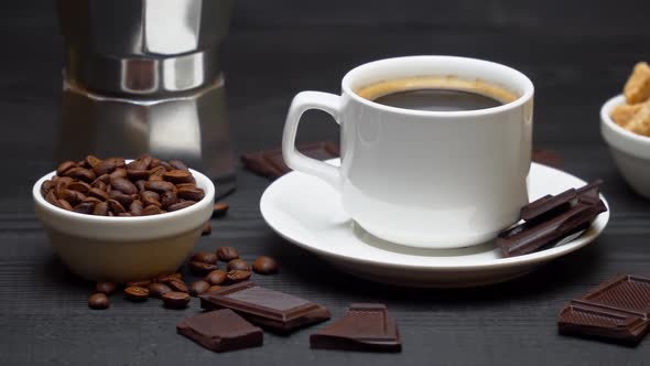 Cup of Espresso Coffee Mocha Cream or Milk and Brown Sugar on Dark Wooden Background