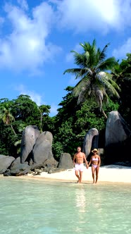 Anse Takamaka Beach Mahe Seychelles Tropical Beach with Palm Trees and a Blue Ocean Couple Man and