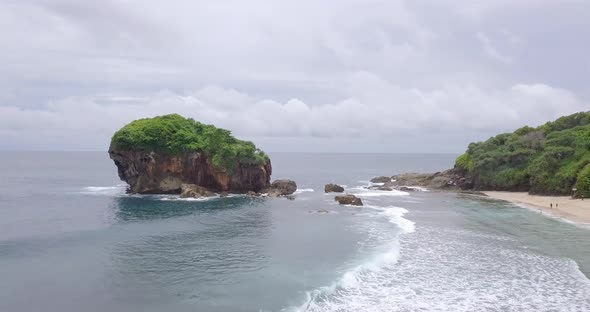 Aerial Jungwok Beach Gunung Kidul Regency, Yogyakarta, Indonesia. the sea water looks blue with some