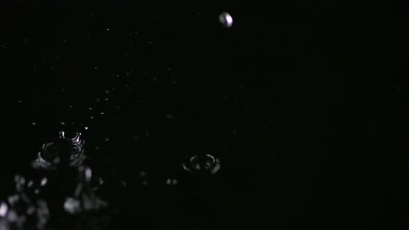 Water droplets in puddle, Slow Motion