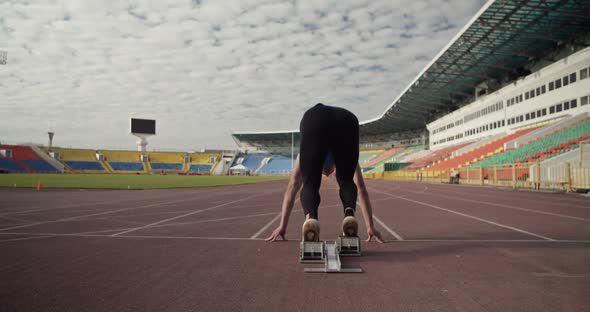 Sportsman Running and Jumping Over Obstacles