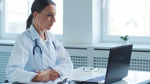 Professional medical doctors working in hospital office making research.