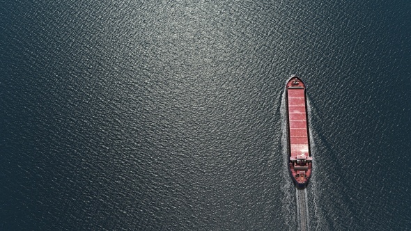 Aerial top view of Empty cargo ship in the ocean