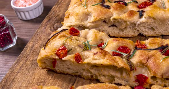 Traditional Italian Focaccia with pepperoni, cherry tomatoes, black olives, rosemary ando onion - ho