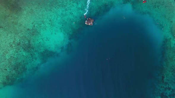 Overhead boom down aerial view of the pristine waters of Jan Thiel Beach, Curacao, Dutch Caribbean i