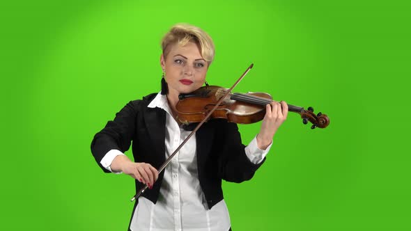 Musician Girl Plays the Violin Composition. Green Screen