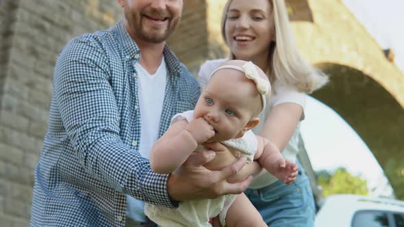 A Happy Family is Resting Outside the City and Traveling By Car