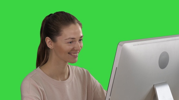 Student blonde girl looking at monitor of computer and alt