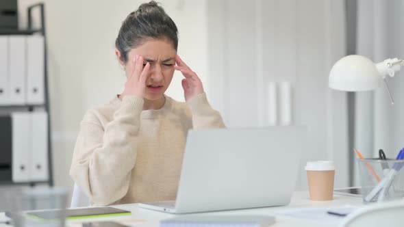 Indian Woman Having Headache at Work