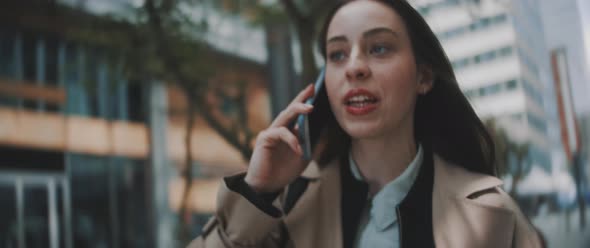 Woman walks and talks on phone