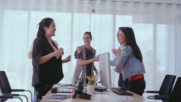 Successful Business People Celebrating Project Success at Office