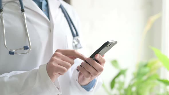 Close Up of Doctor Using Smartphone Mobile